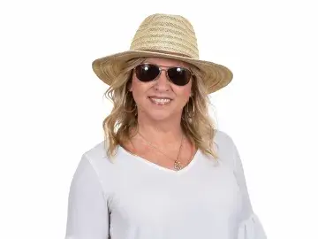 Diana Smith in straw hat and sunglasses against a white background.