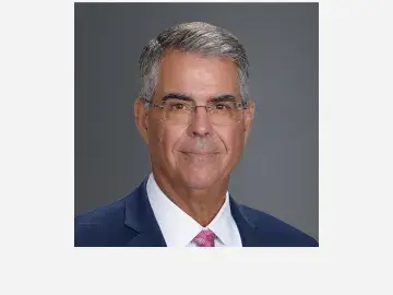 Andrew Serafini in a suit and pink tie