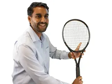 Abi Kulshreshtha, PhD holding a tennis racquet
