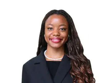 Ebahi Adubor in dark blazer on white background.